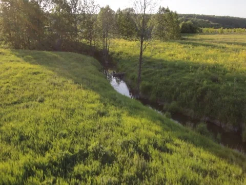 Flying over the river and the field.Sunny Day Stock Footage 100191734