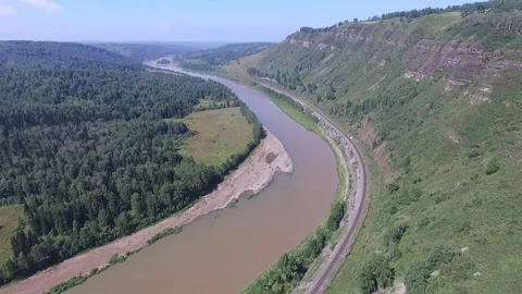 Flying over the river and the forest around the cliffs Stock Footage 71223639
