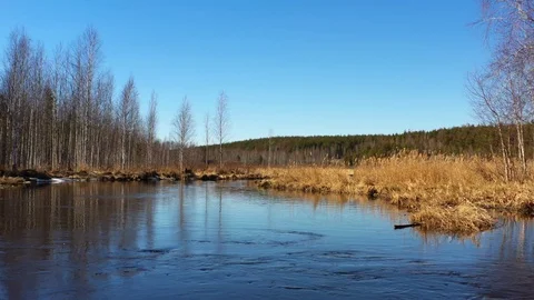 Flying over the river and the opening panorama of the field, forests and roads Stock Footage 107504563