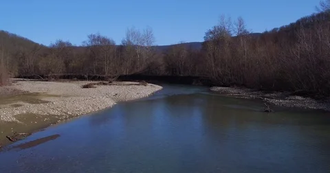 Flying over the river and trees in the mountains Stock Footage 74427517