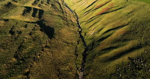 Flying over a river and valley at sunrise Stock Footage 335195603