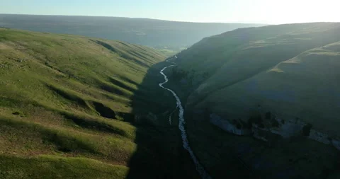 Flying over a river and valley in north Yorkshire Stock Footage 335196248