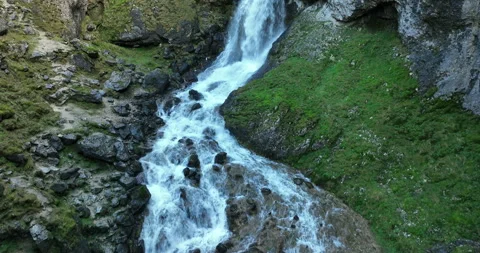 Flying over a river and waterdfall in a rocky gorge Stock Footage 272797898