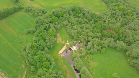 Flying over a river and waterfall. a picturesque place surrounded by forest Stock Footage 155750995
