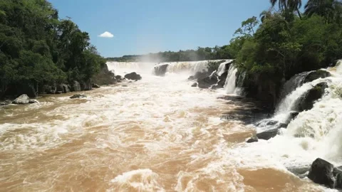 Flying over a river and a waterfall at low altitude. Salto Saudades. 4K. Stock Footage 233219758