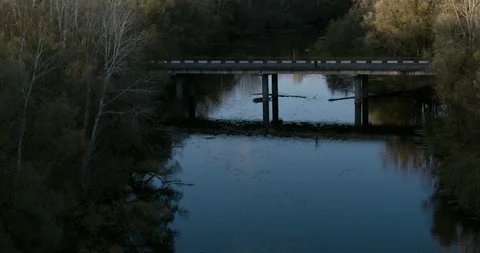 Flying over River approaching to Bridge 4K Aerial view Stock Footage 117839333