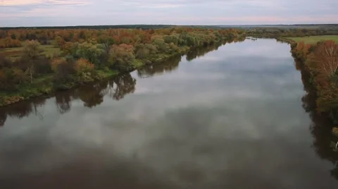 Flying over the river on the background of autumn forest Stock Footage 68735123