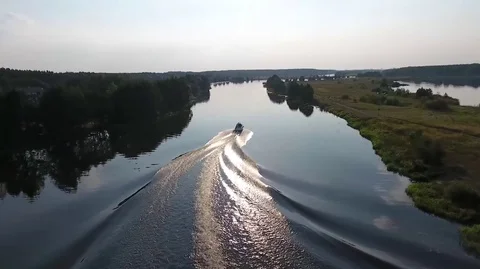 Flying over the river for a boat going to meet the sun Stock Footage 71798833