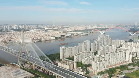Flying over the river on both banks of which we see a lot of buildings. Stock Footage 113668600