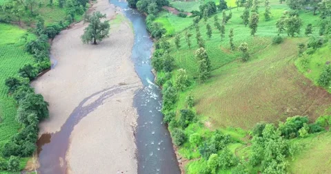 Flying Over River With Fields And Village Huts Along The Banks, Aerial View Stock Footage 154861786
