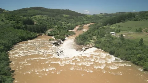 Flying over a river flowing into a waterfall. Salto Saudades. 4K. Aerial. Stock Footage 233219799