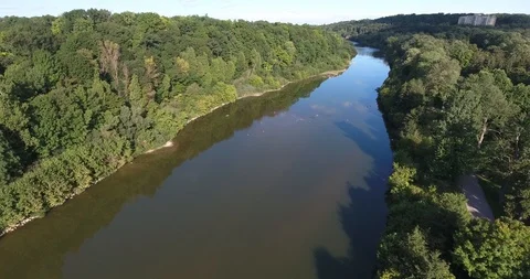 Flying Over River With Forests And Apartment Building Stock Footage 95014828