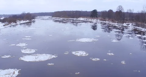 Flying over the river with melting ice floes, aerial view Stock Footage 85923246