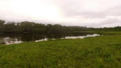 Flying over the river. Reflection of clouds in water Stock Footage 72607569