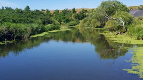 Flying over the river, shooting from a drone. Beautiful aerial view Stock Footage 121987169
