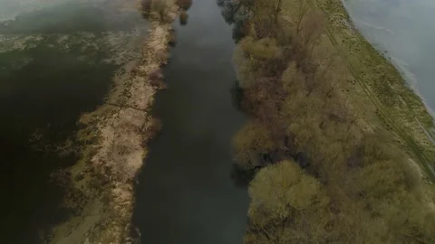 Flying over the river in the spring flood. Flooding of fields. Europe. Video stock 151683266