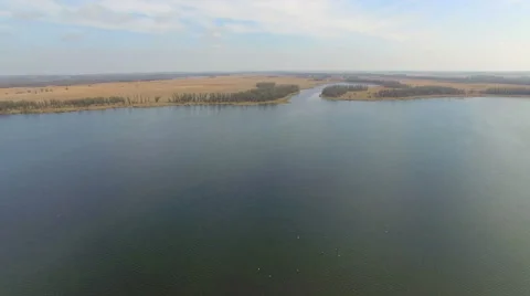 Flying over the river on a sunny day Stock Footage 63077981