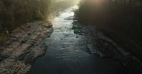 Flying over a river at sunrise Video stock 307311988