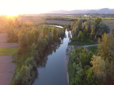 Flying over river in the sunset Stock Footage 80806277