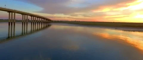 Flying over river at sunset Stock Footage 143641056