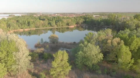 Flying over a river in the sunset with small islands and trees Stock Footage 232486958