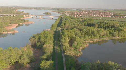 Flying over a river in the sunset with small islands and trees Stock Footage 232487068