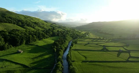 Flying over river Swale at sunset Stock Footage 343820793