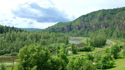 Flying over the river towards the ridge. Stock Footage 116675744