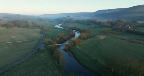 Flying over river Ure on a sunny morning Stock Footage 307403396