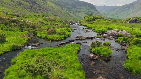 Flying over river in valley between mountains Killarney National Park, Ireland Stock Footage 312562210