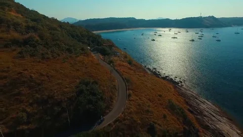 Flying over the road and the beach by the sea Stock Footage 69188864