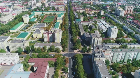 Flying over the road and rooftops of the town Video stock 153337692