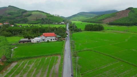 Flying over the road between landscapes 4K Video in Vietnam Stock Footage 235813605