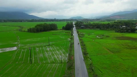 Flying over the road between landscapes 4K Video in Vietnam 1 Stock Footage 235813792