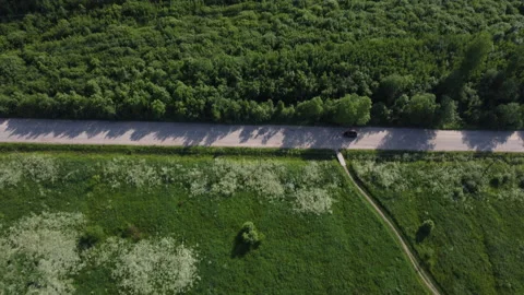Flying over the road in the field Stockbeeldmateriaal 157897880