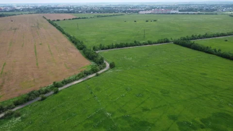 Flying over the road in the field Stockbeeldmateriaal 157900511