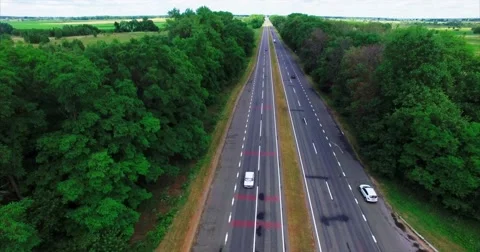 Flying Over the Road in the Forest Stock-Footage 64924963