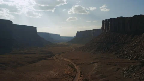 Flying over a road in a remote desert canyon Stock Footage 143664000