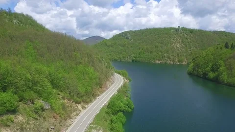 Flying over the road, river and mountains 스톡 동영상 73232593