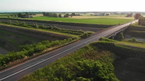Flying over a road in slow motion, cars passing Stock Footage 131880530