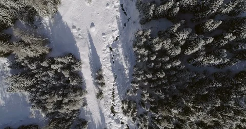 Flying over a road in a snow covered mountain in Switzerland. Stock Footage 92551164