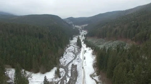 Flying over the road through the forest in the mountains Stock Footage 59123473