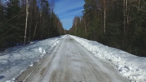 Flying over the road in the winter Stock-Footage 79988285