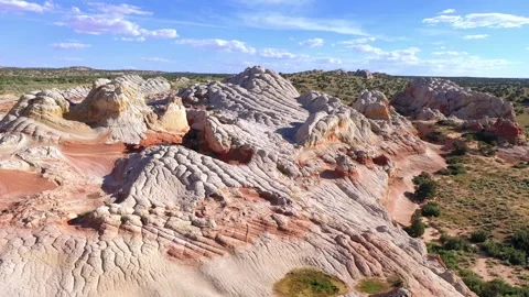 Flying over the rock formations of White Pocket in the Vermillion Cliffs Stock Footage 247674292