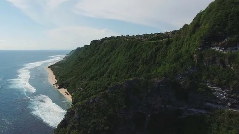 Flying over the rock to the secret beach Stock Footage 77556765