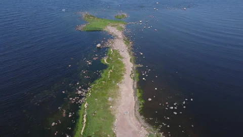 Flying over rocks in the water Stockbeeldmateriaal 160480696