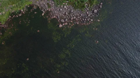 Flying over rocks in the water Stockbeeldmateriaal 160480957