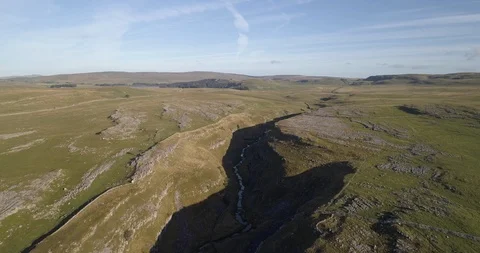 Flying over a rocky gorge Stock Footage 116689154