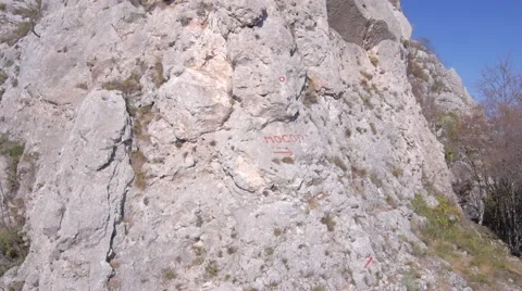 Flying over the rocky mountain peak Stock Footage 48846384