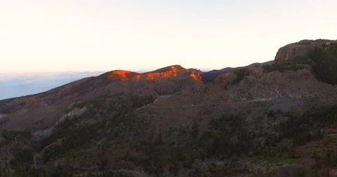 Flying over a rocky mountain peak on a drone. Stockbeeldmateriaal 237479125